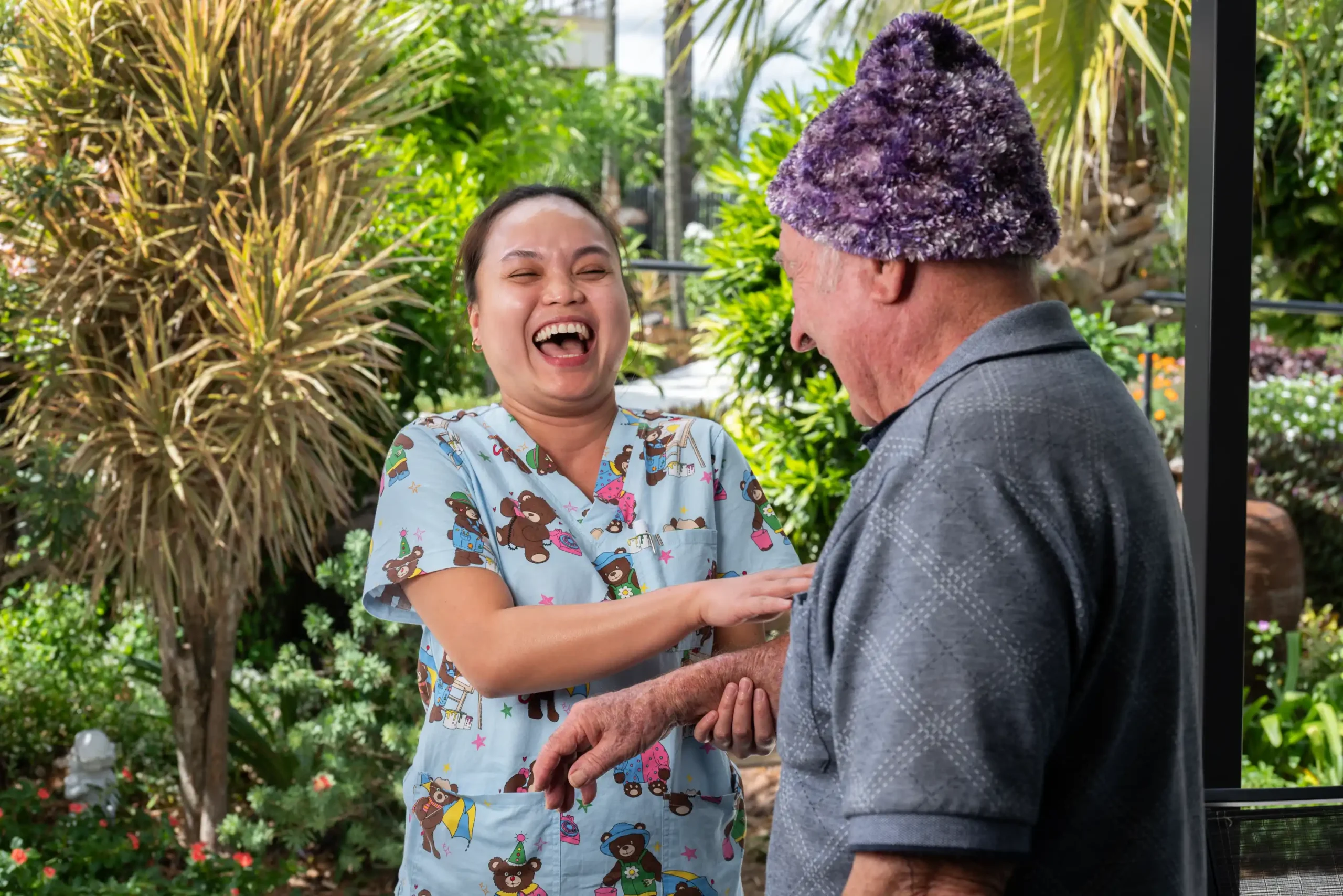 Nurse talking with older female patient.